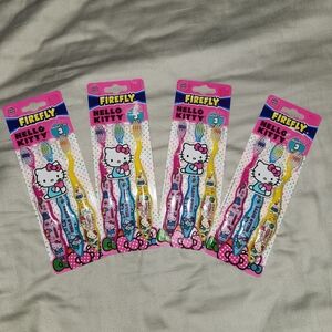 4 sets of 3 hello kitty toothbrushes total of Hello Kitty Firefly Toothbrush Set